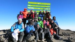 Kili team on the summit of Uhuru Peak
